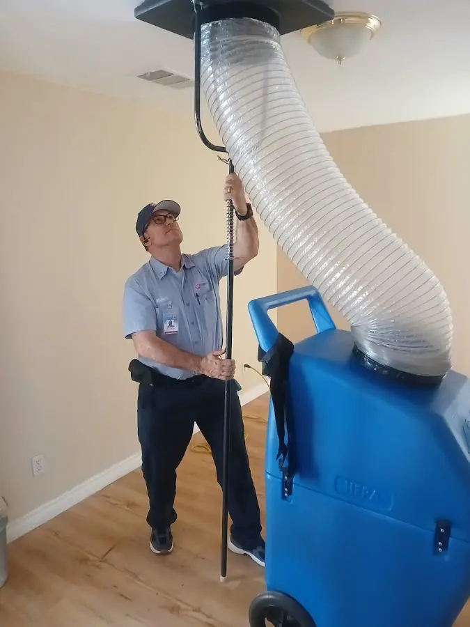 Furnace Tune-Up technician using HEPA equipment in Palo Alto